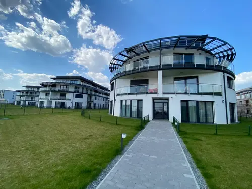 Kerek formájú apartmanépület a Dandelion Royal Homes lakóparkban
